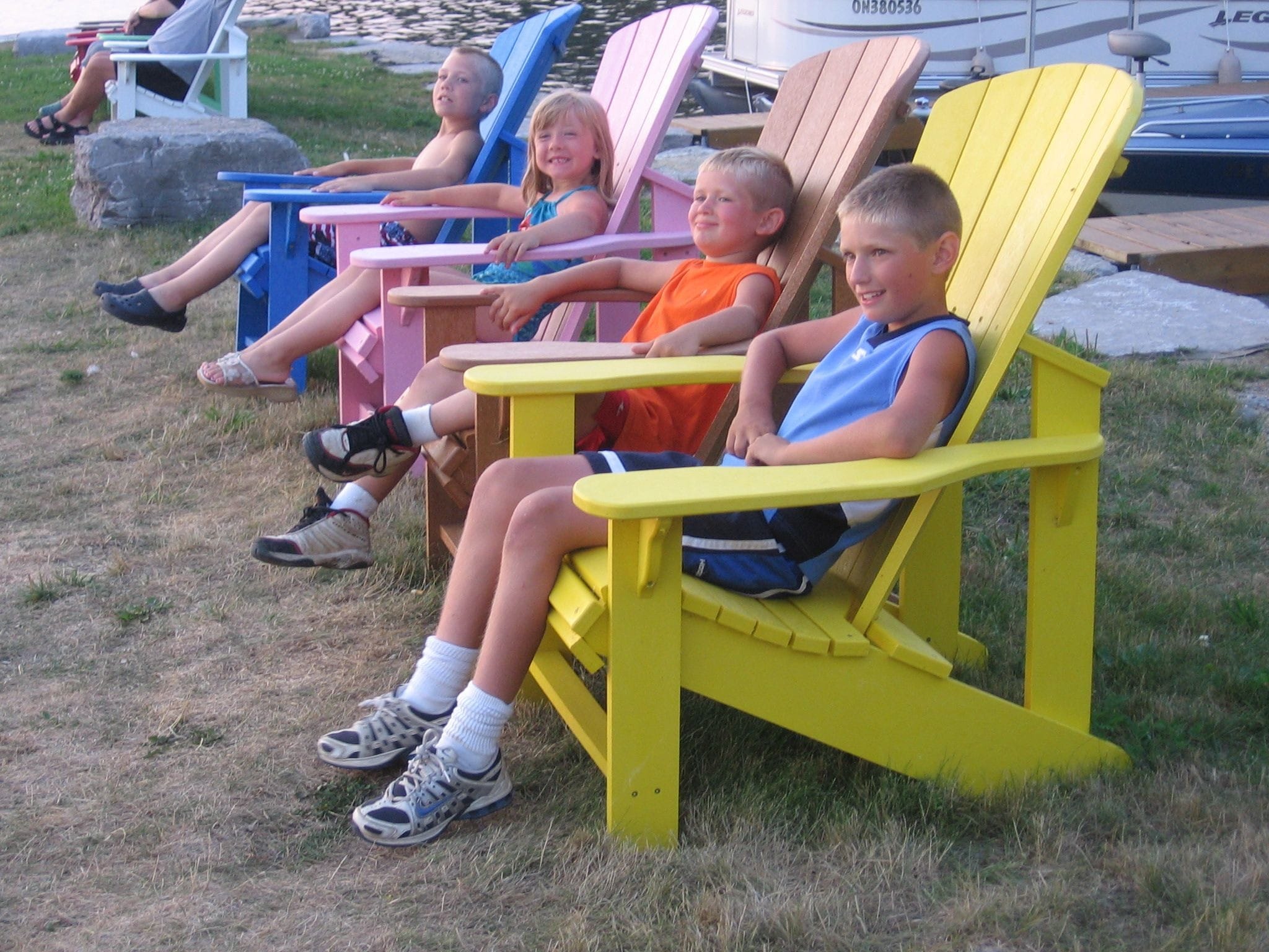 Kids Sitting on Adirondack Chairs